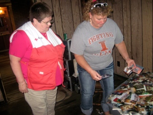 Karen shows a Red Cross volunteers her family photos she is trying to save